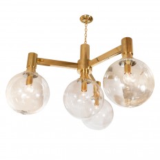 Brass three arm chandelier with clear glass spherical shades